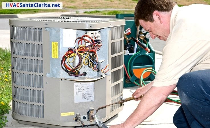 911 Cooling HVAC technician servicing equipment